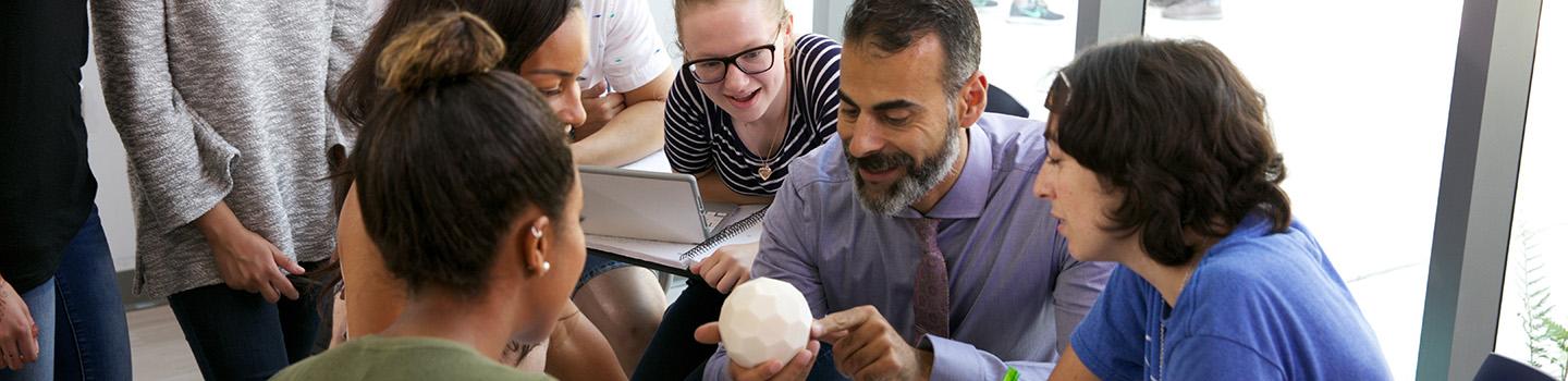 Katsioloudis教授 & ODU students work together in a classroom inside the new education building.